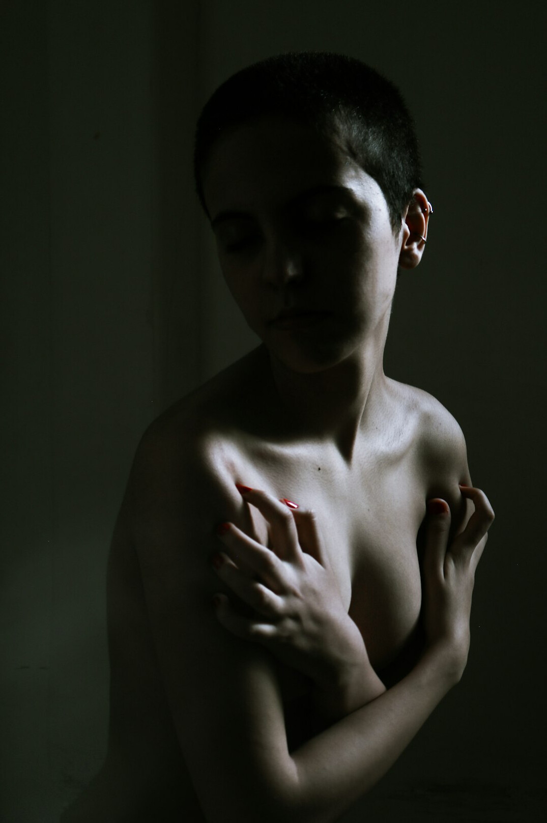 Studio portrait of a woman with short dark hair