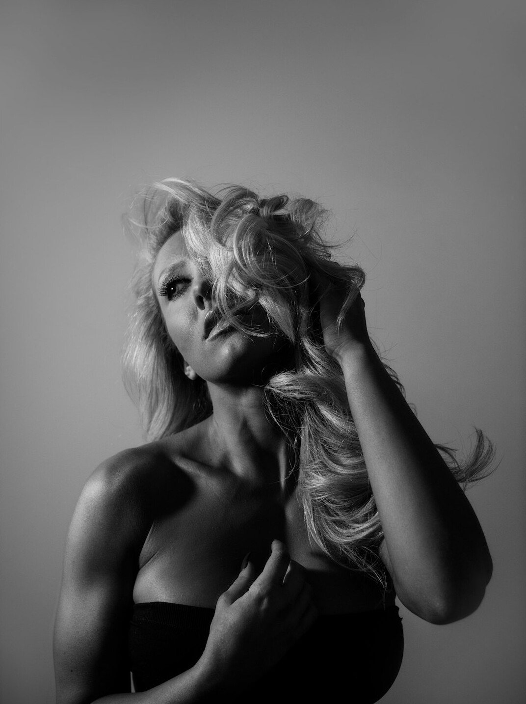 Studio portrait of a woman with long blonde hair